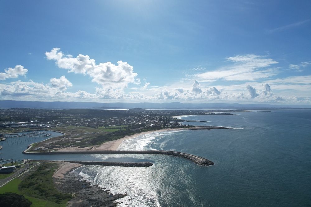 An Aerial View Of A Beach And A Body Of Water — Sunblitz Window Tinting In Shellharbour, NSW