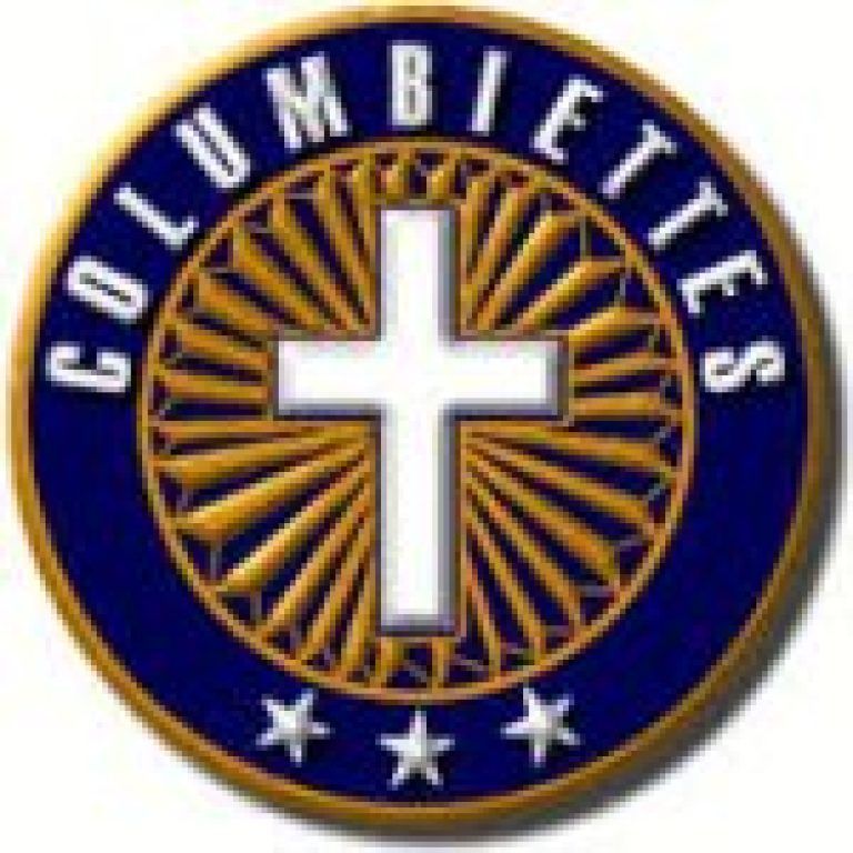 Columbiettes emblem with a white cross on a blue and gold circular background, with stars below