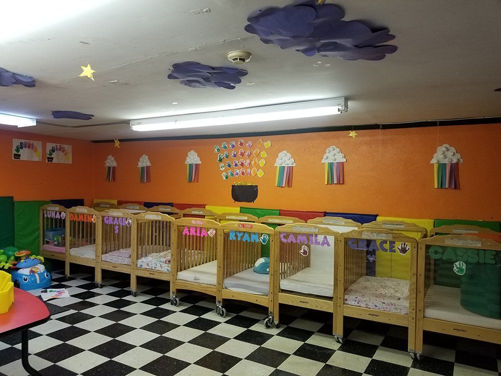 A room filled with cribs and a checkered floor