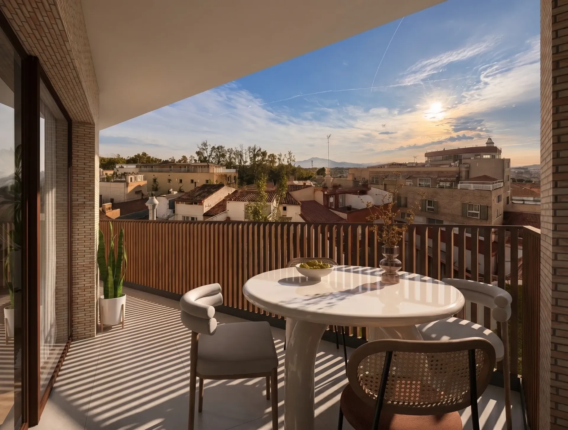Render inmobiliario de balcón alargado con mesa redonda y vistas al atardecer