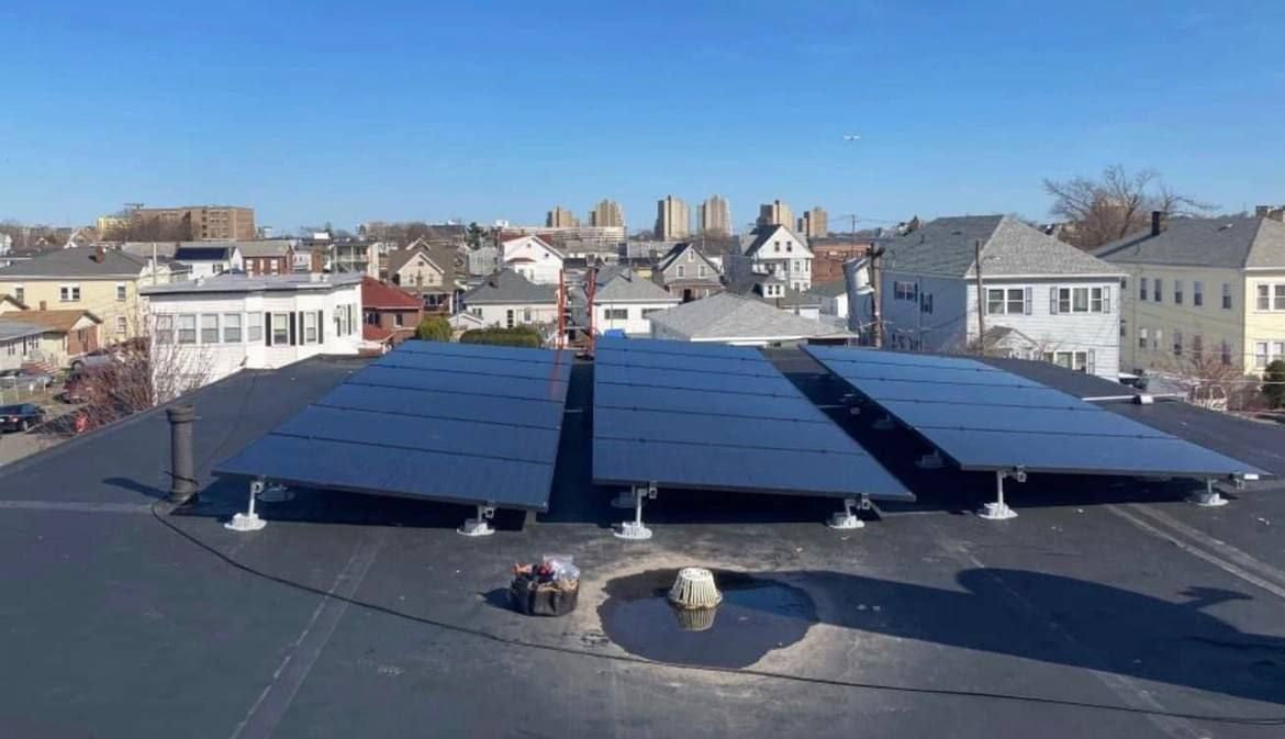 Merrimack Solar team member reviewing design plans in Merrimack, NH