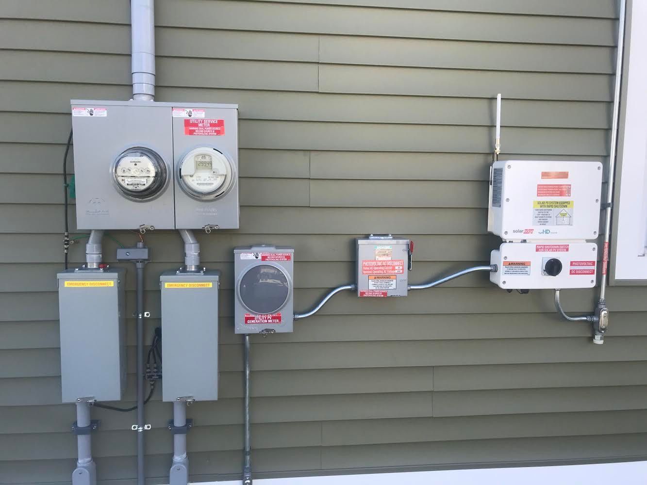 Close-up of Tesla Powerwall unit mounted on a garage wall
