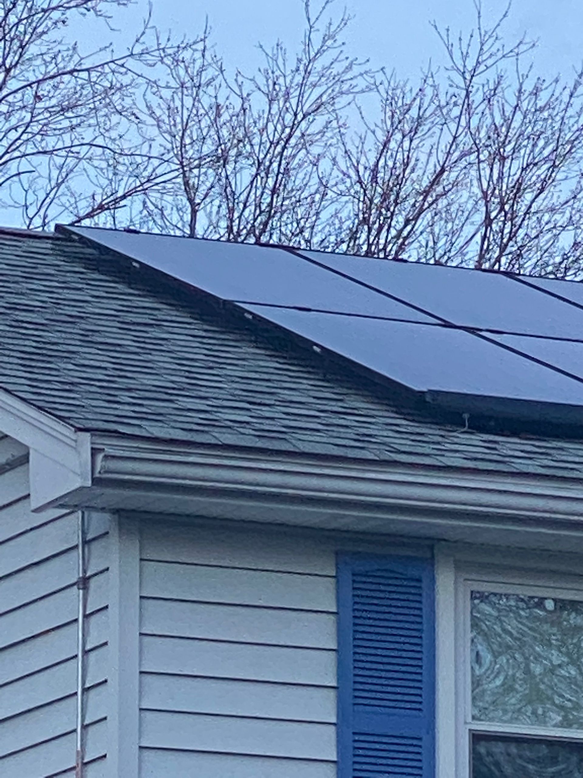 Merrimack Solar technicians securely installing rooftop panels in Merrimack, NH
