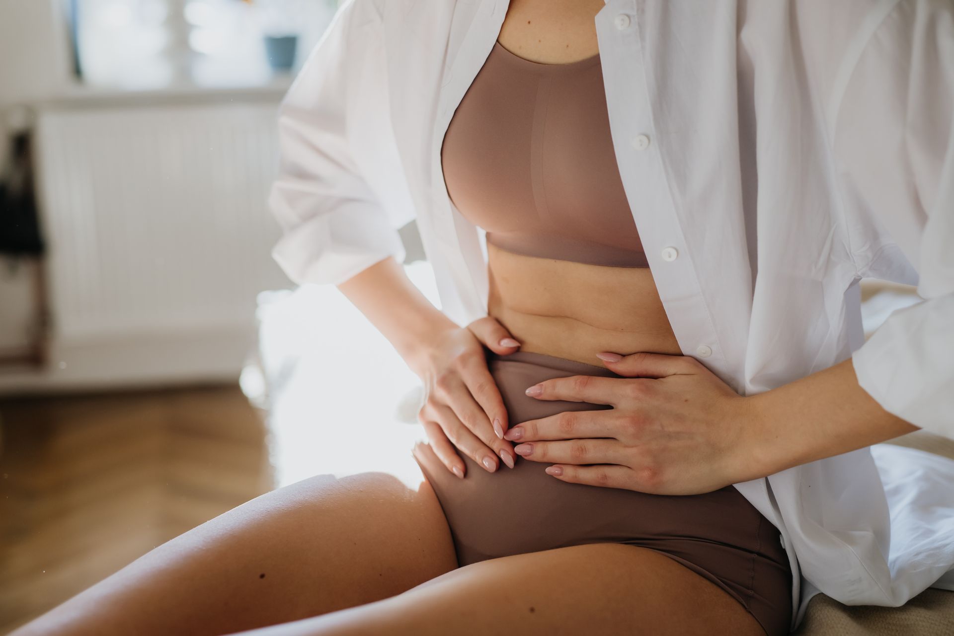 woman holding her stomach