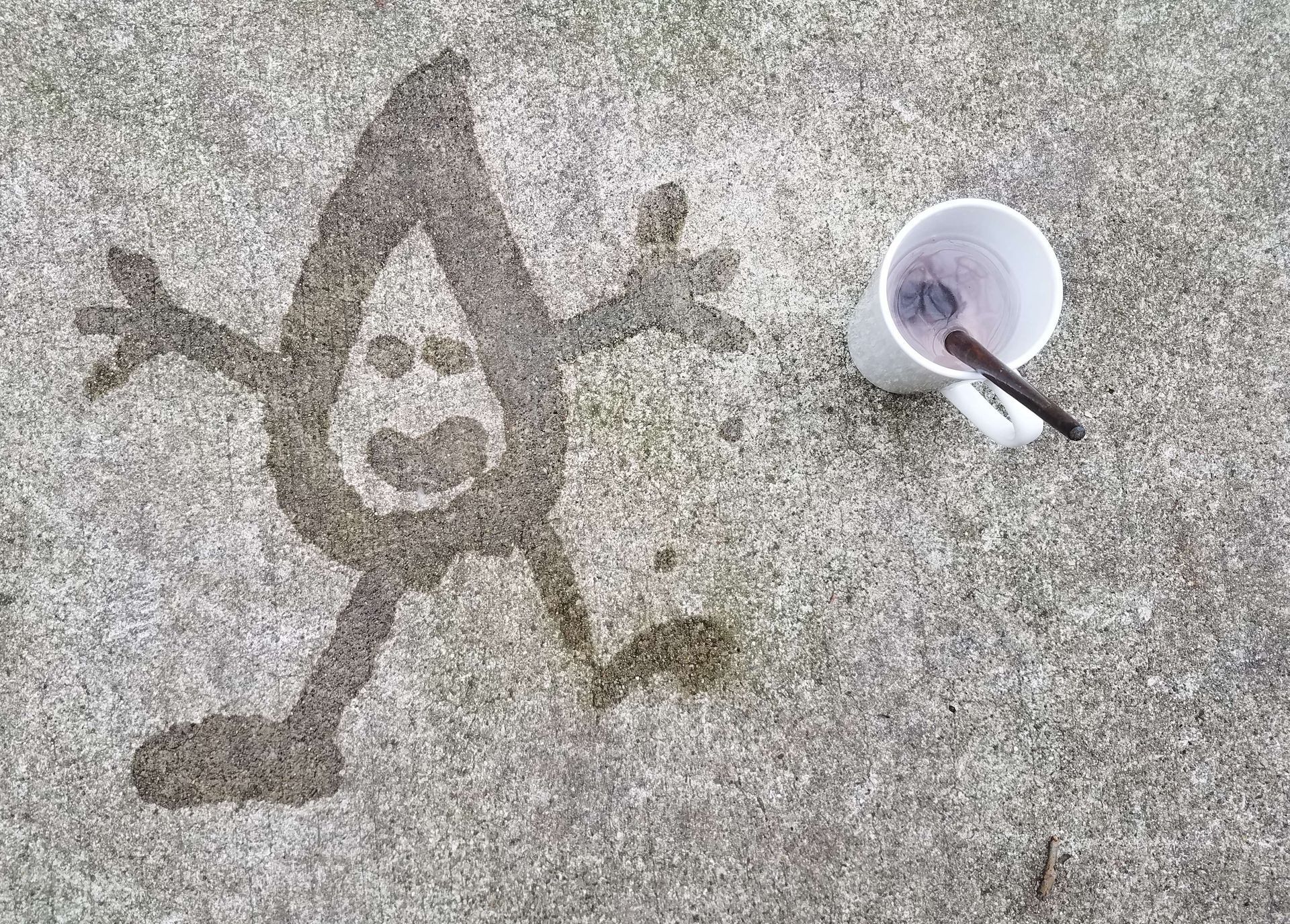 Henry the water drop drawn on a sidewalk using water. 