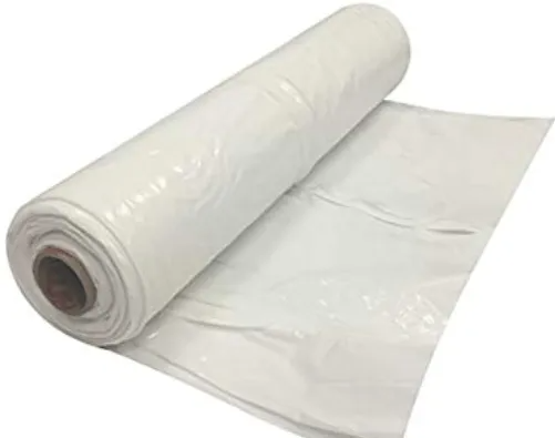 White roll of plastic sheeting with a loose sheet unrolled on a plain background