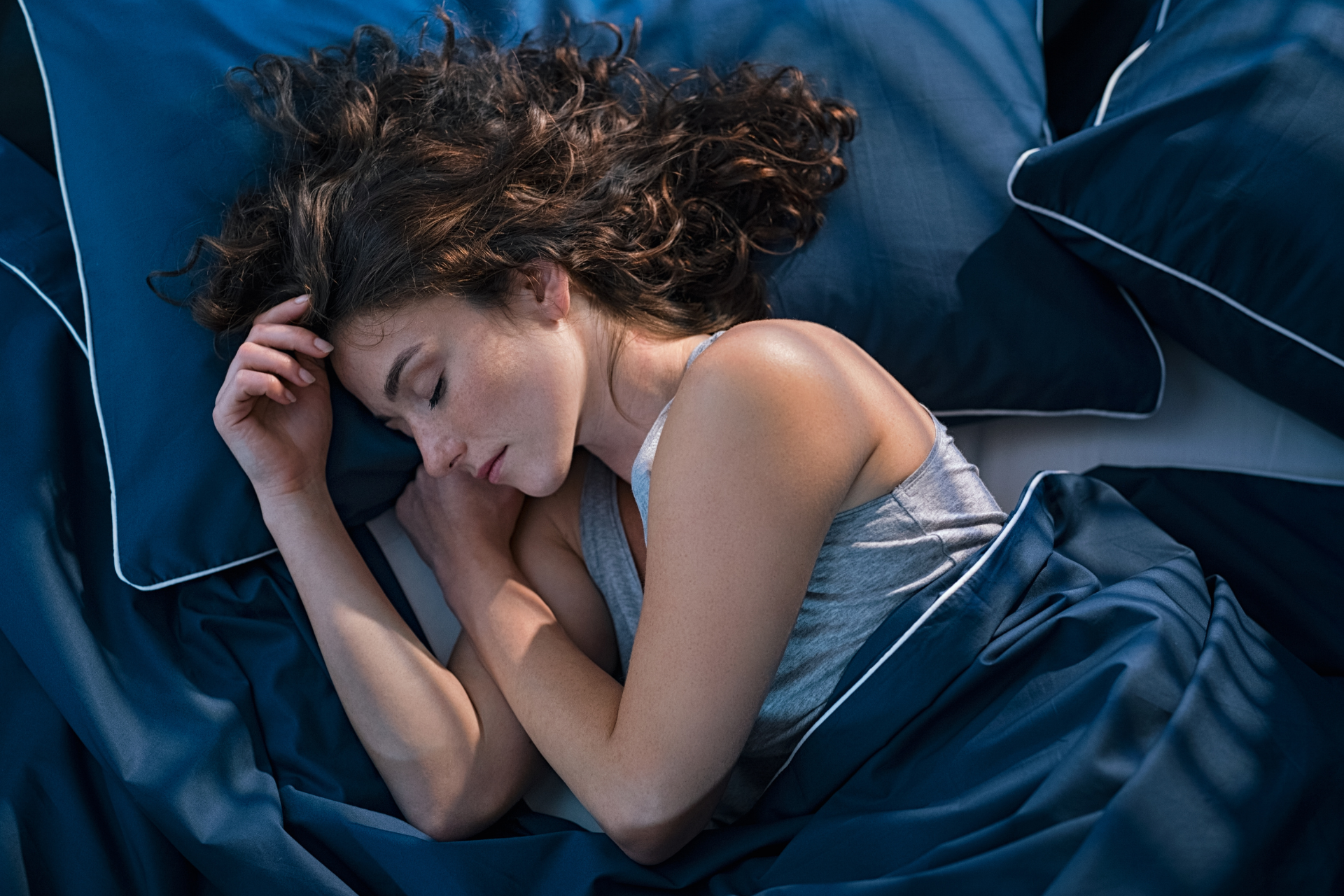 a girl sleeping on her bed