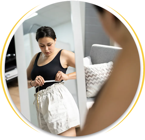girl measuring her waist