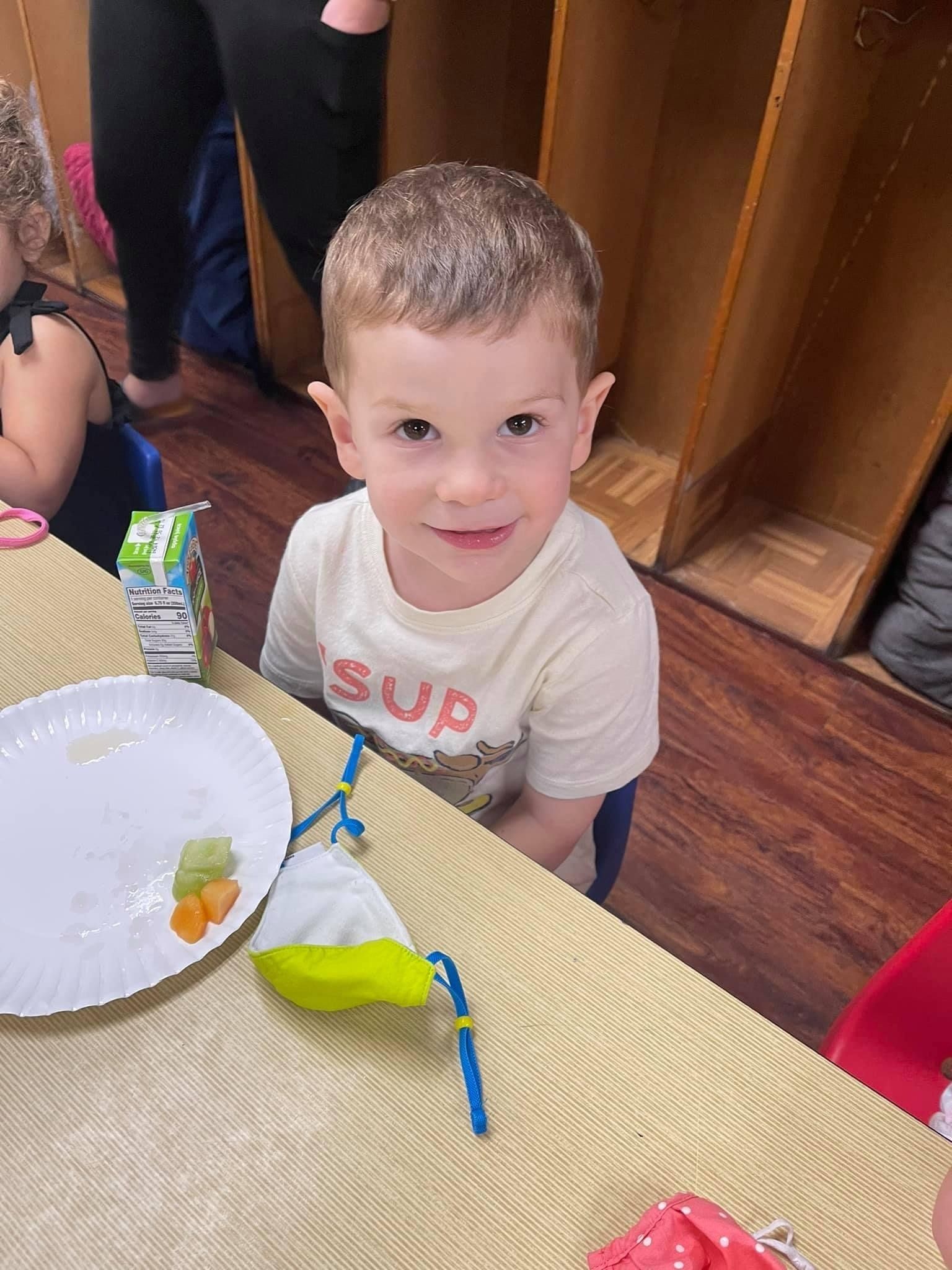 young boy having fun at school