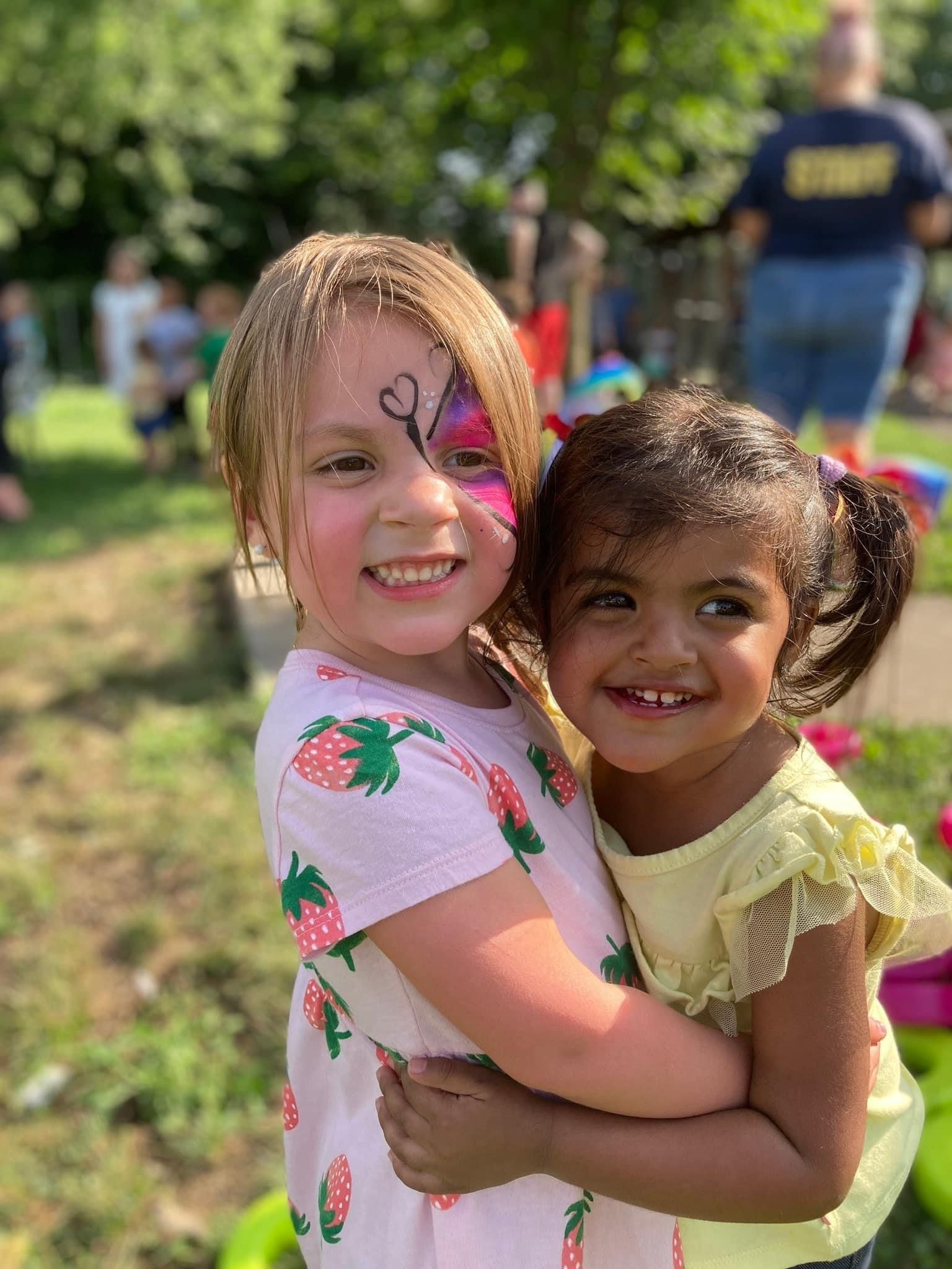 two young girls enjoying school
