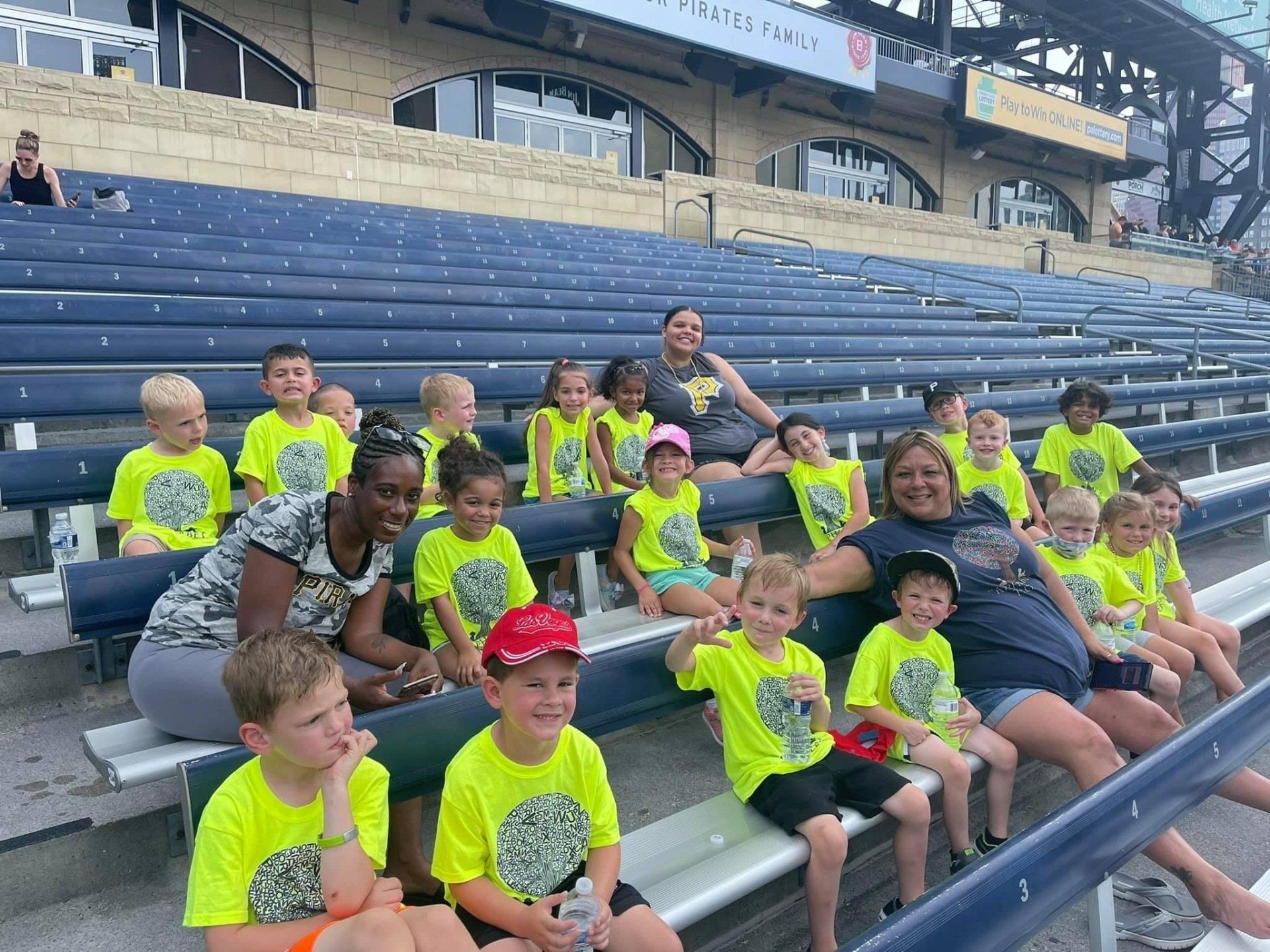 kids in the bleachers watching a pirates game