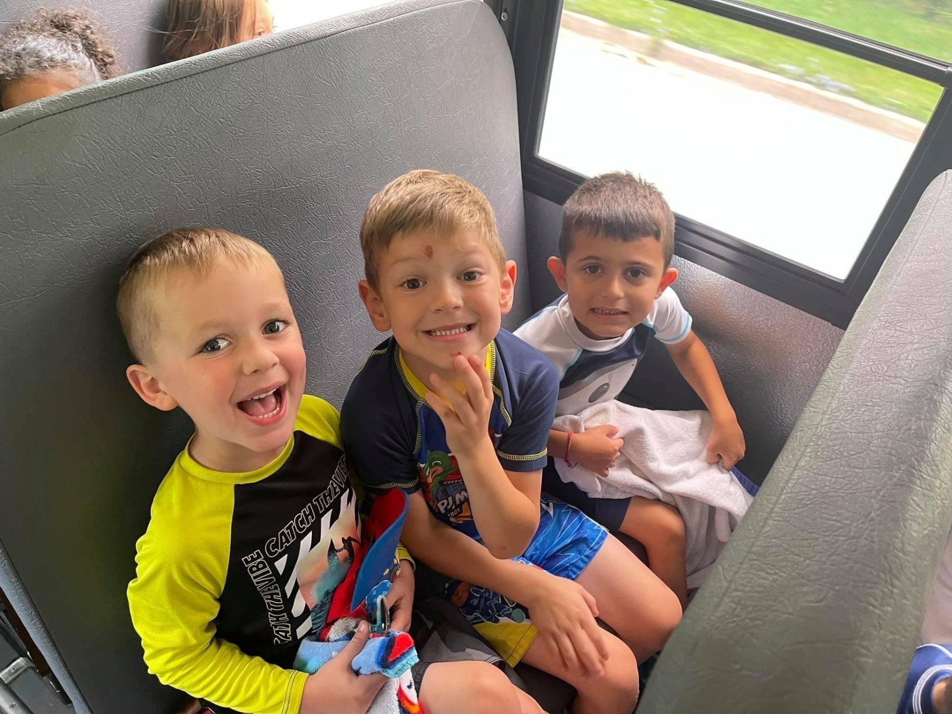 kids on the bus ready to depart for a preschool class trip