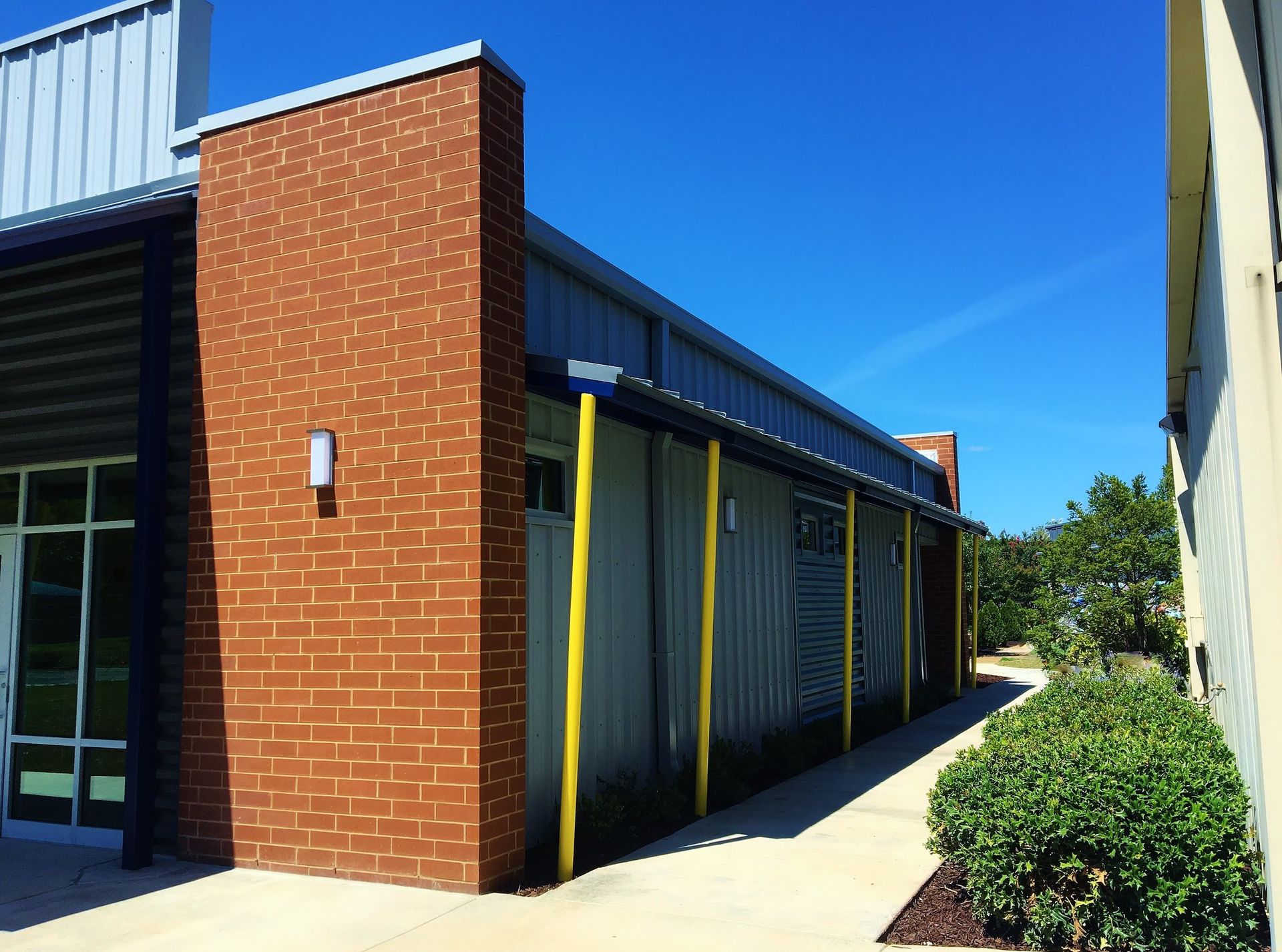 A brick building with a blue sky in the background