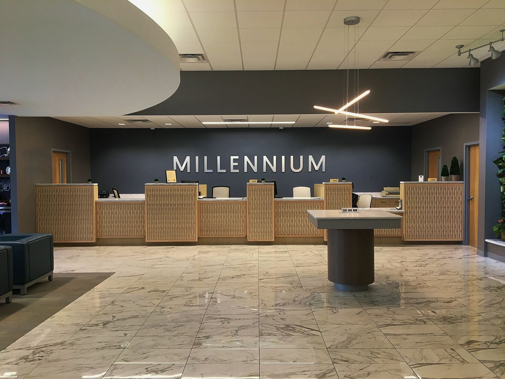 A lobby with a sign that says millennium on it