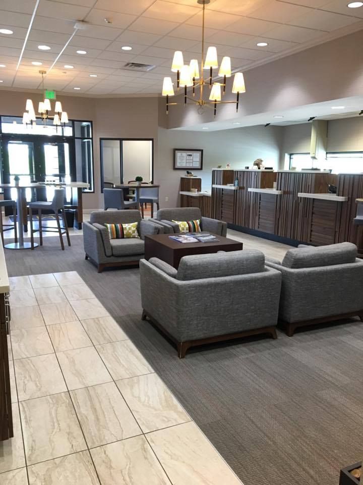 A large room with a lot of furniture and a chandelier