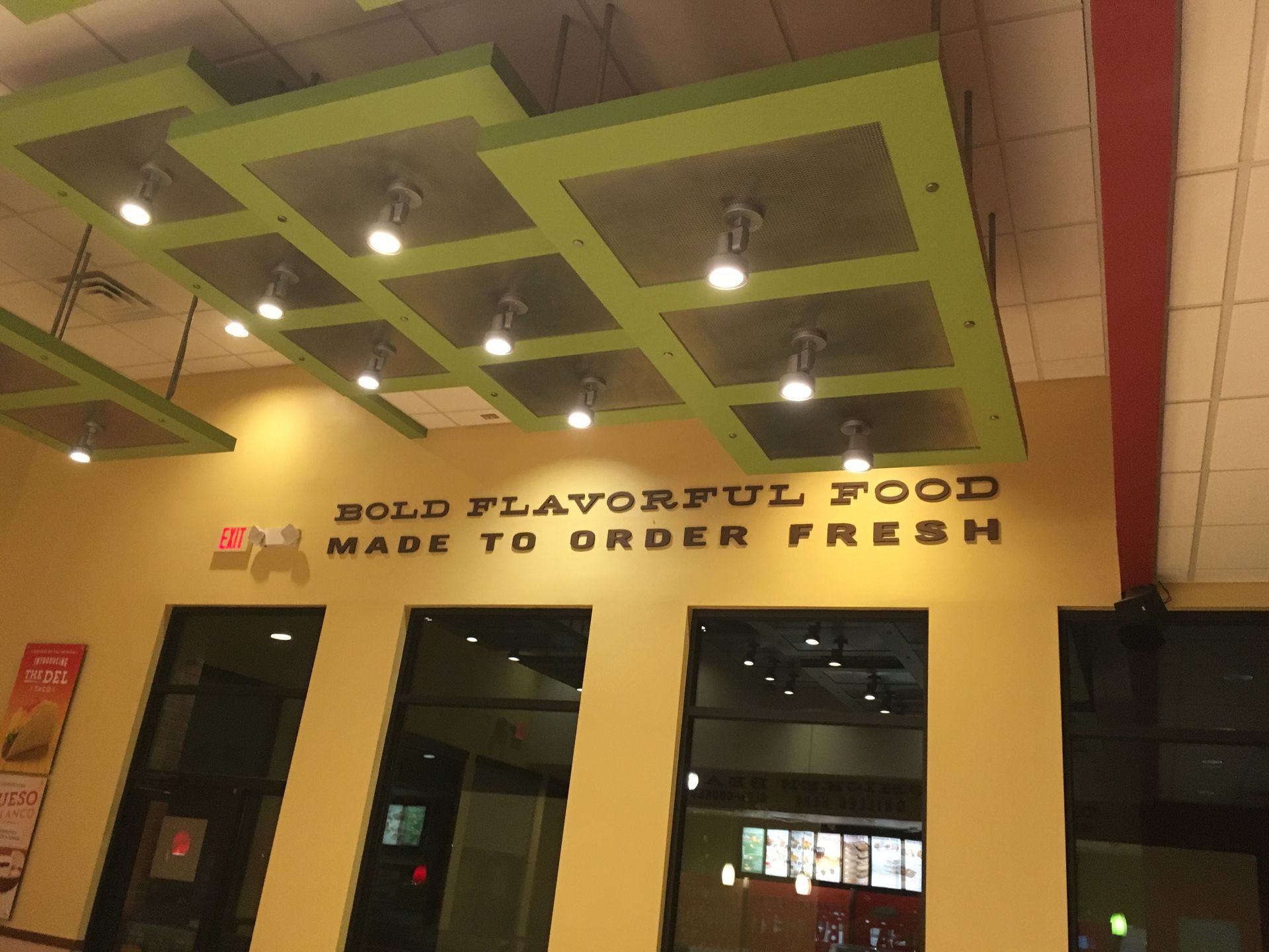 A sign that says bold flavorful food made to order fresh