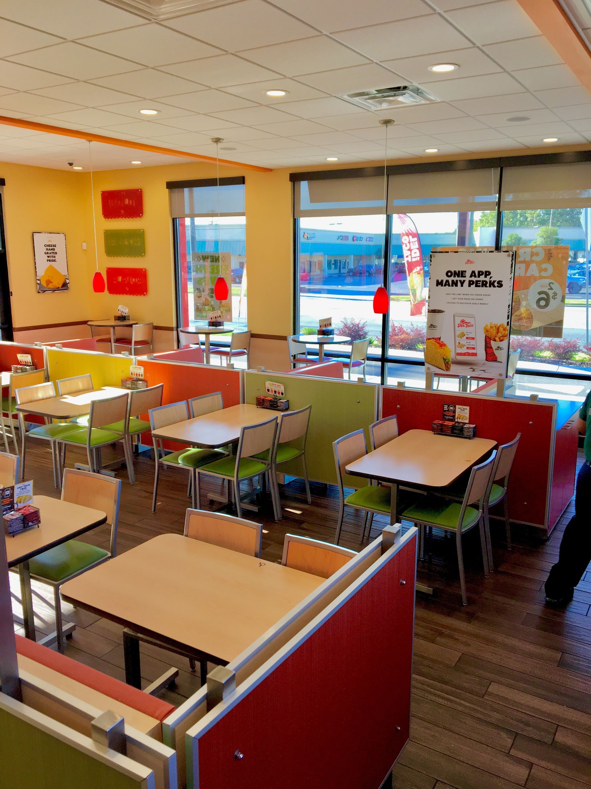 A restaurant with tables and chairs and a sign that says 100 % vegetables