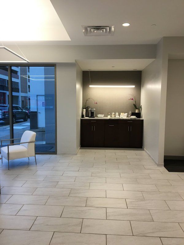 A room with a chair and a counter in it