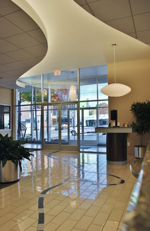 A lobby with a ceiling that has a swirl in it
