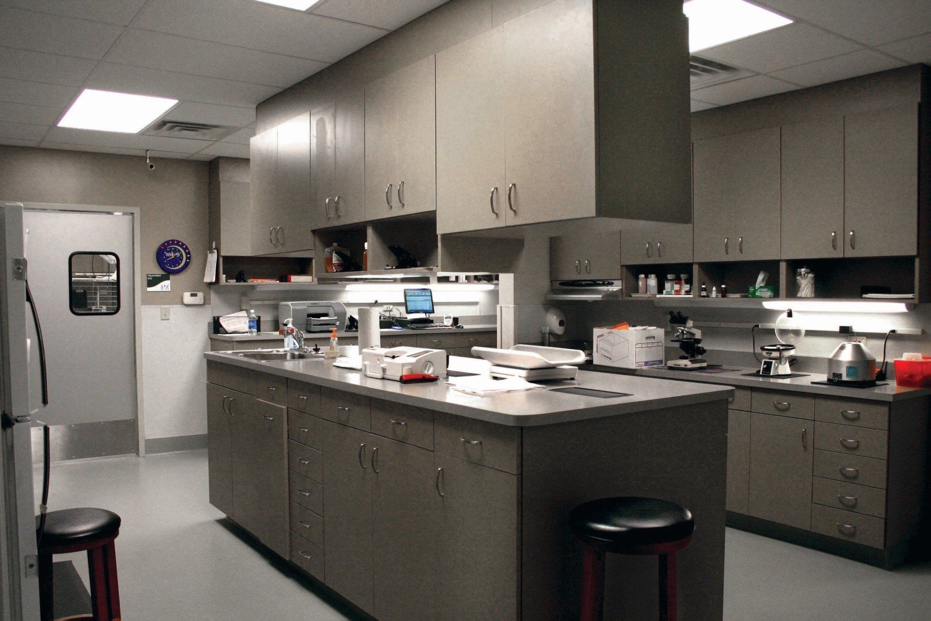 A kitchen with a large island and stools