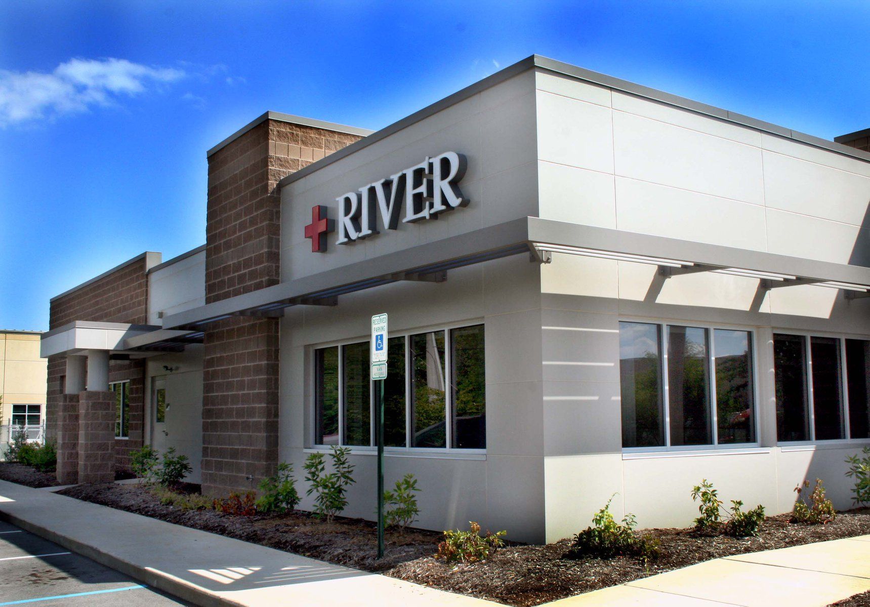 A white building with the word river on it