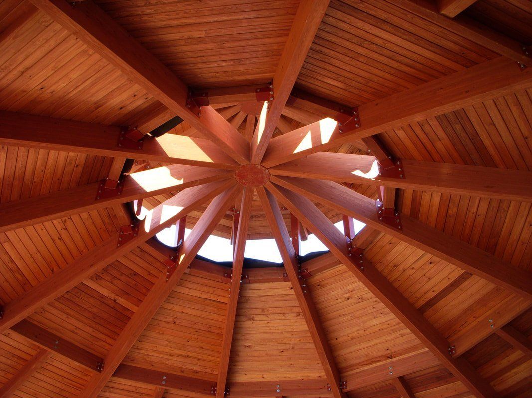 Looking up at the ceiling of a wooden structure