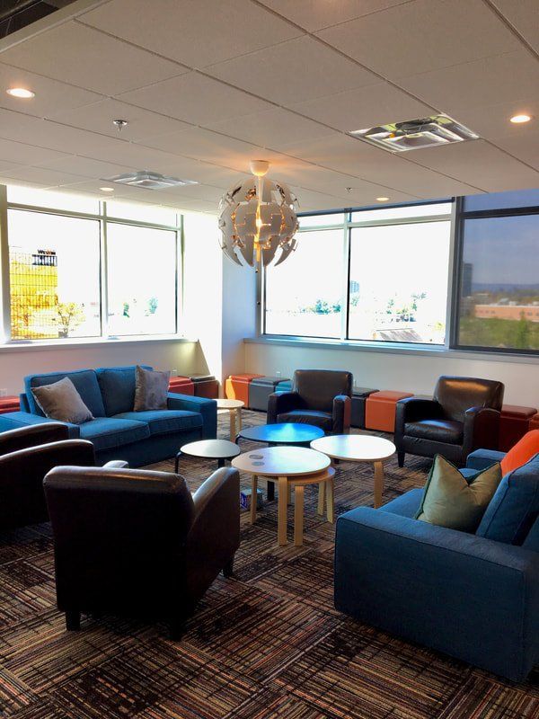 A living room with a lot of furniture and tables