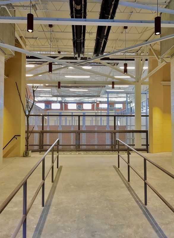 An empty building with a staircase and a railing