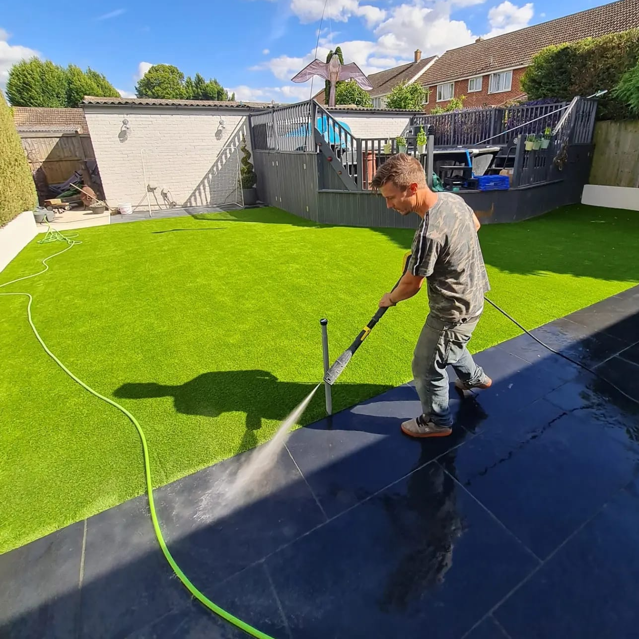 Patio installation showing landscaping services and equipment