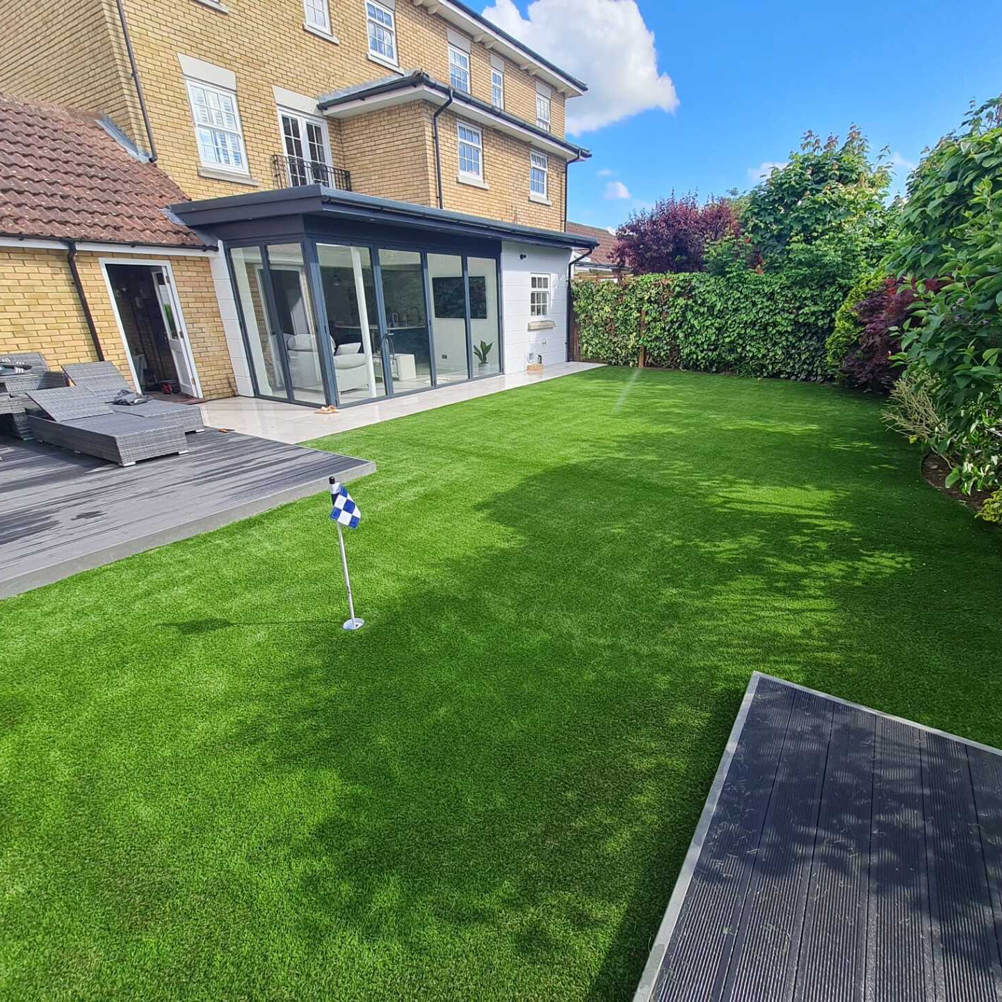 Landscaped garden with artificial grass lawn in Suffolk, we also cover Norfolk, Essex, Cambridgeshire and Hertfordshire.