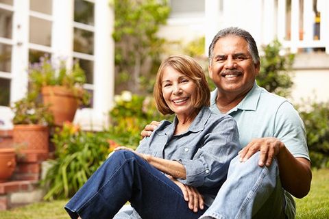 Senior Couple Relaxing in Garden at Home — KS & MO — Leary & Associates