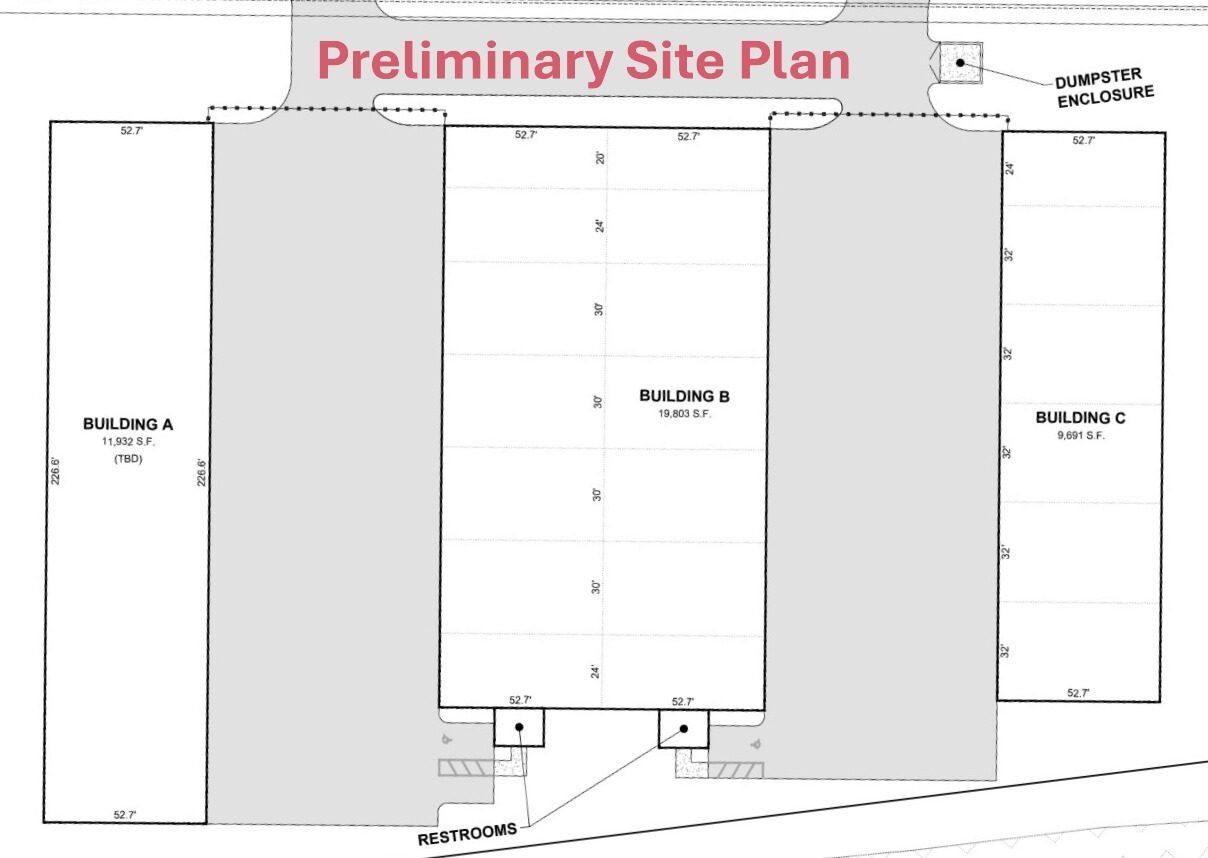 Preliminary site plan showing three building blocks and parking areas on a lot