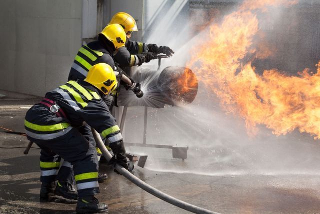 Actual Photo Of Killing The Fire Service Point Location With Person Inside Of Inside Three People With Star Fire Extinguisher — Cincinnati, OH — Kramer & Associates Fire and EMS Consulting