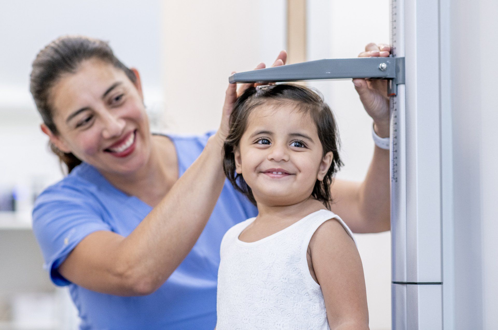 Little Girl Getting Measured At The Doctors — Surprise, AZ — Arizona Kids Pediatrics