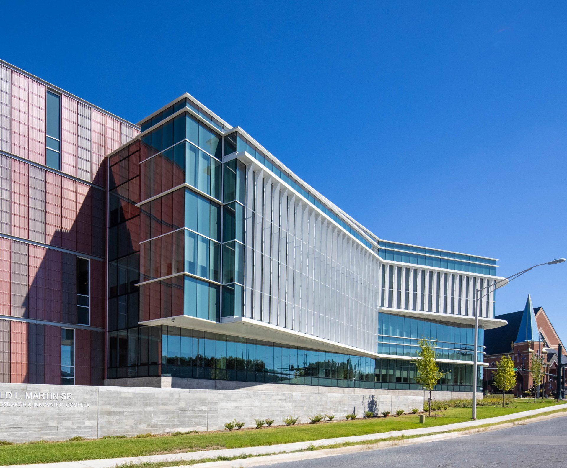 A large building with a lot of windows on a sunny day
