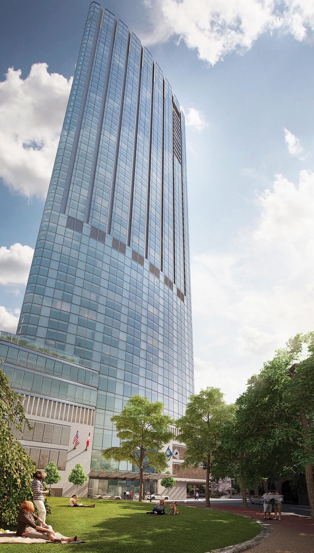 a tall building with a lot of windows is surrounded by trees and grass .