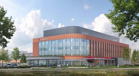 An artist 's impression of a large building with a lot of windows.