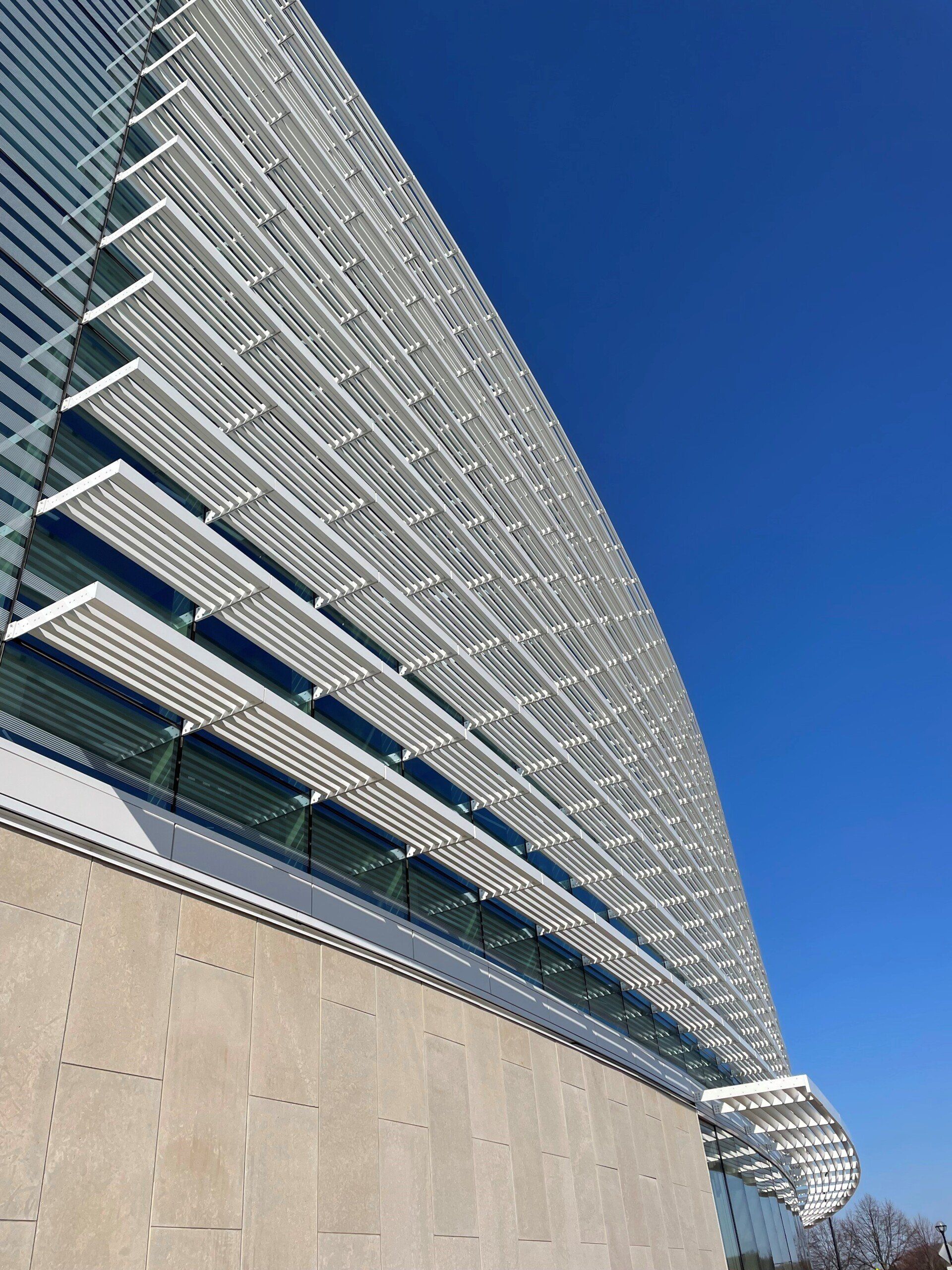 A large building with a blue sky in the background