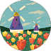 Windmills stand amid a field of tulips under a cloudy blue sky.