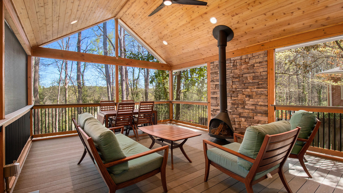 Multi-level composite deck with pergola and Illinois landscaping