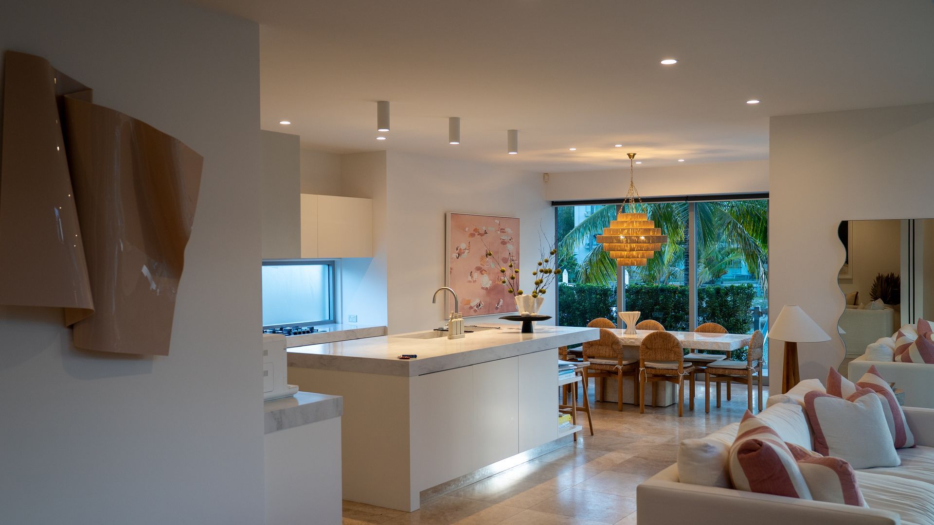 Modern Open-Plan Living Room and Kitchen with White Decor — Ralph Ottmann Electrical in Pomona, QLD