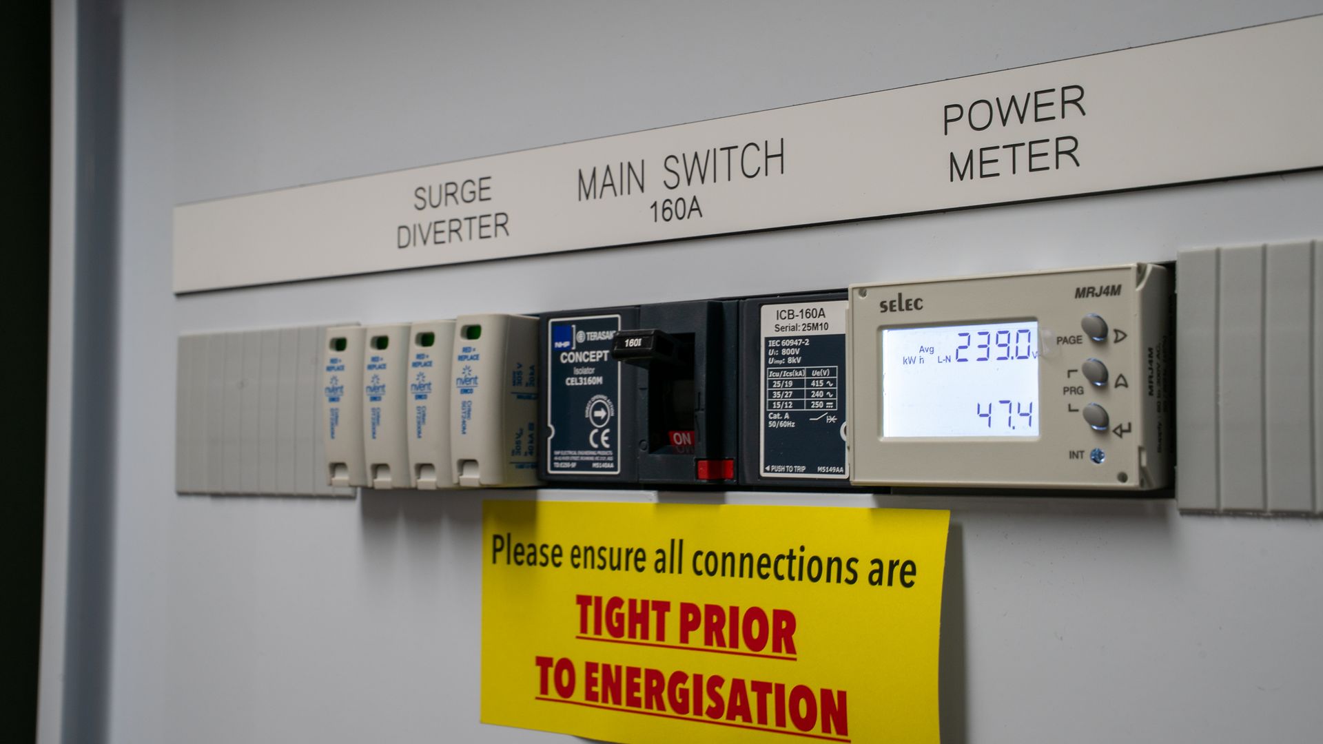 Electrical Control Panel with Switches, Power Meter, and A Warning Sign — Ralph Ottmann Electrical in Pomona, QLD
