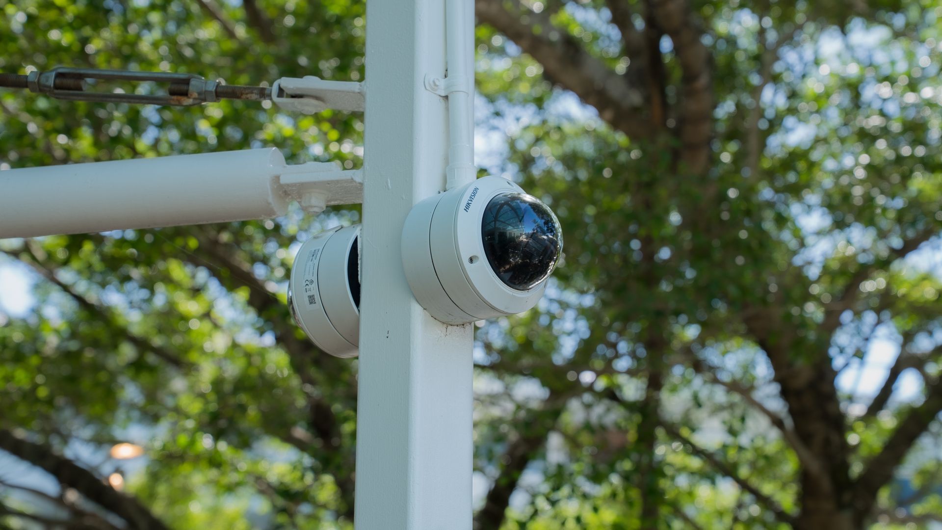White Security Camera Mounted on A Pole — Ralph Ottmann Electrical in Pomona, QLD