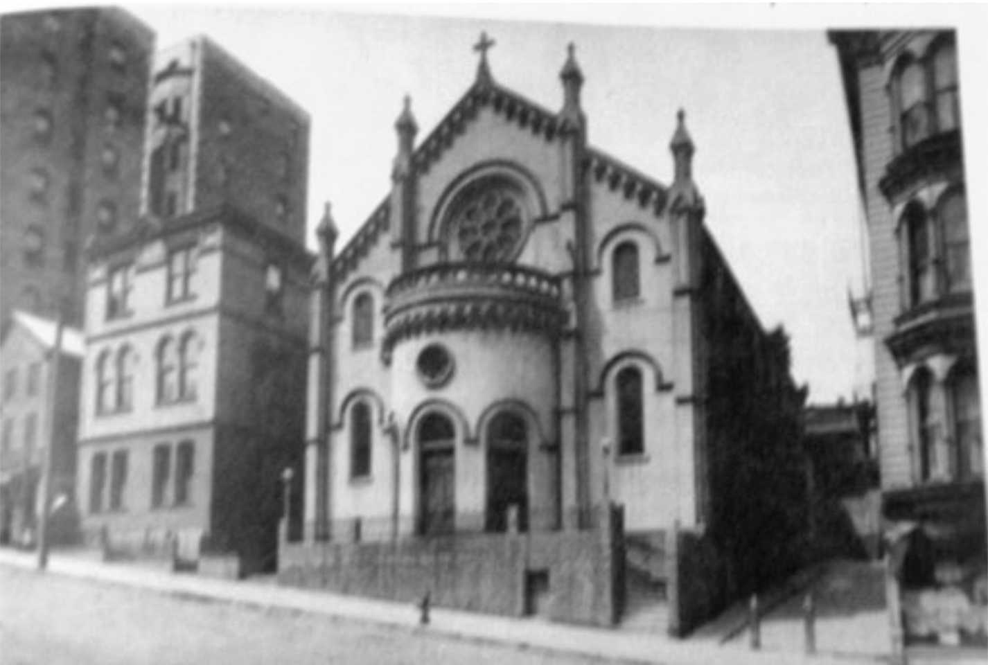 Historic black and white photograph of Notre Dame des Victoires church exterior 