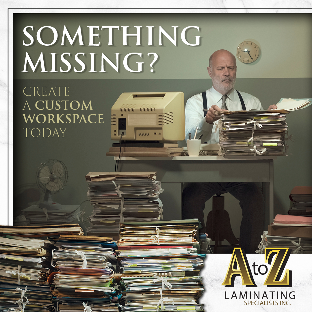 A man sitting at a desk with stacks of papers and a sign that says something missing