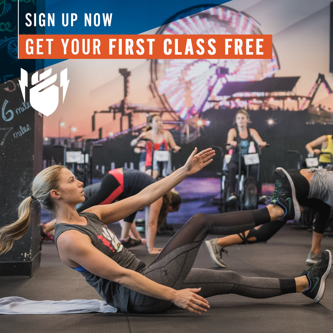 A sign that says sign up now get your first class free