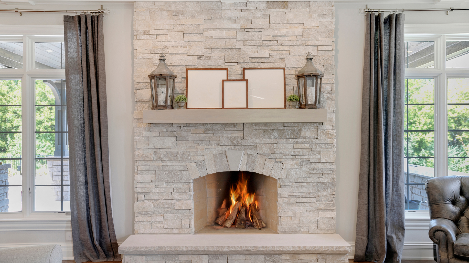 There is a fireplace in the middle of the living room.