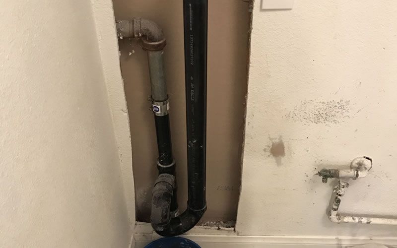 a black pipe with a sticker on it that says ' stainless steel '