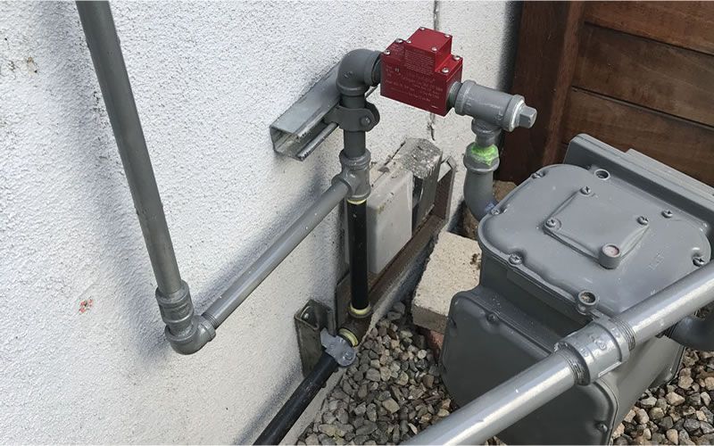 a bunch of plumbing parts are sitting on a wooden table .