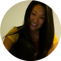 a woman with long black hair is smiling in a circle .